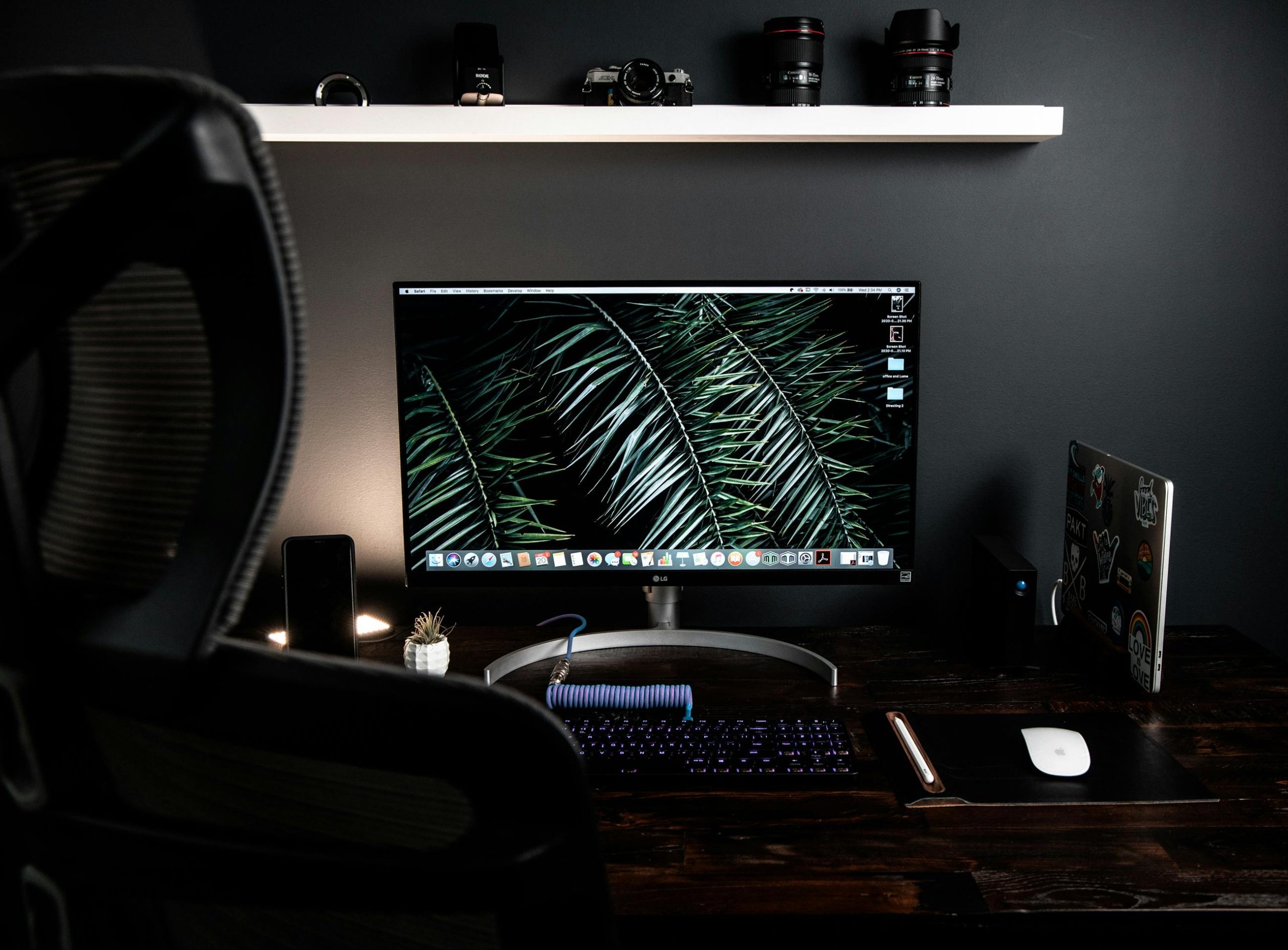 Home office with an ergonomic chair, large computer monitor and ergonomic computer equipment for working from home.